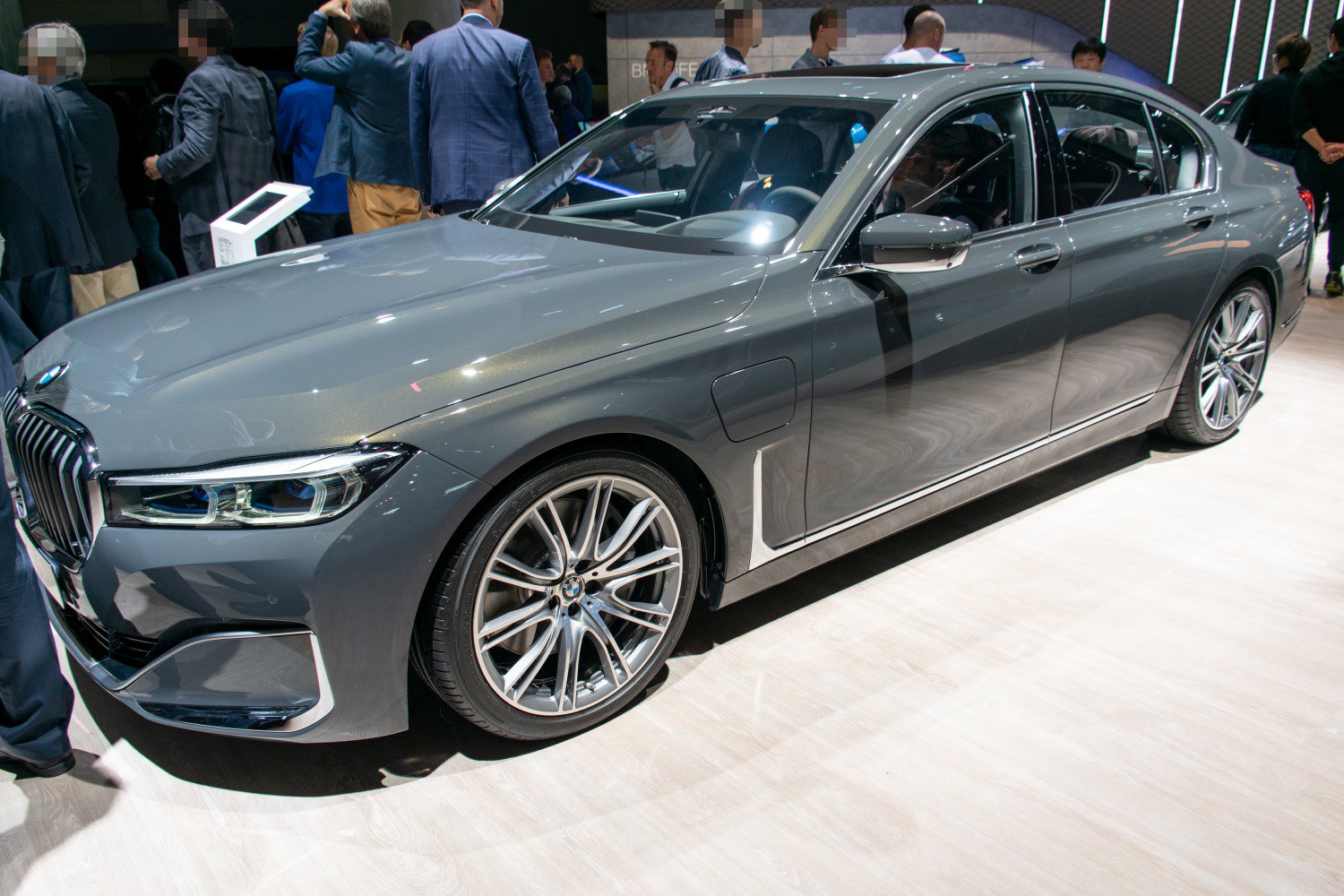 Sleek luxury sedan front and side with alloy wheels