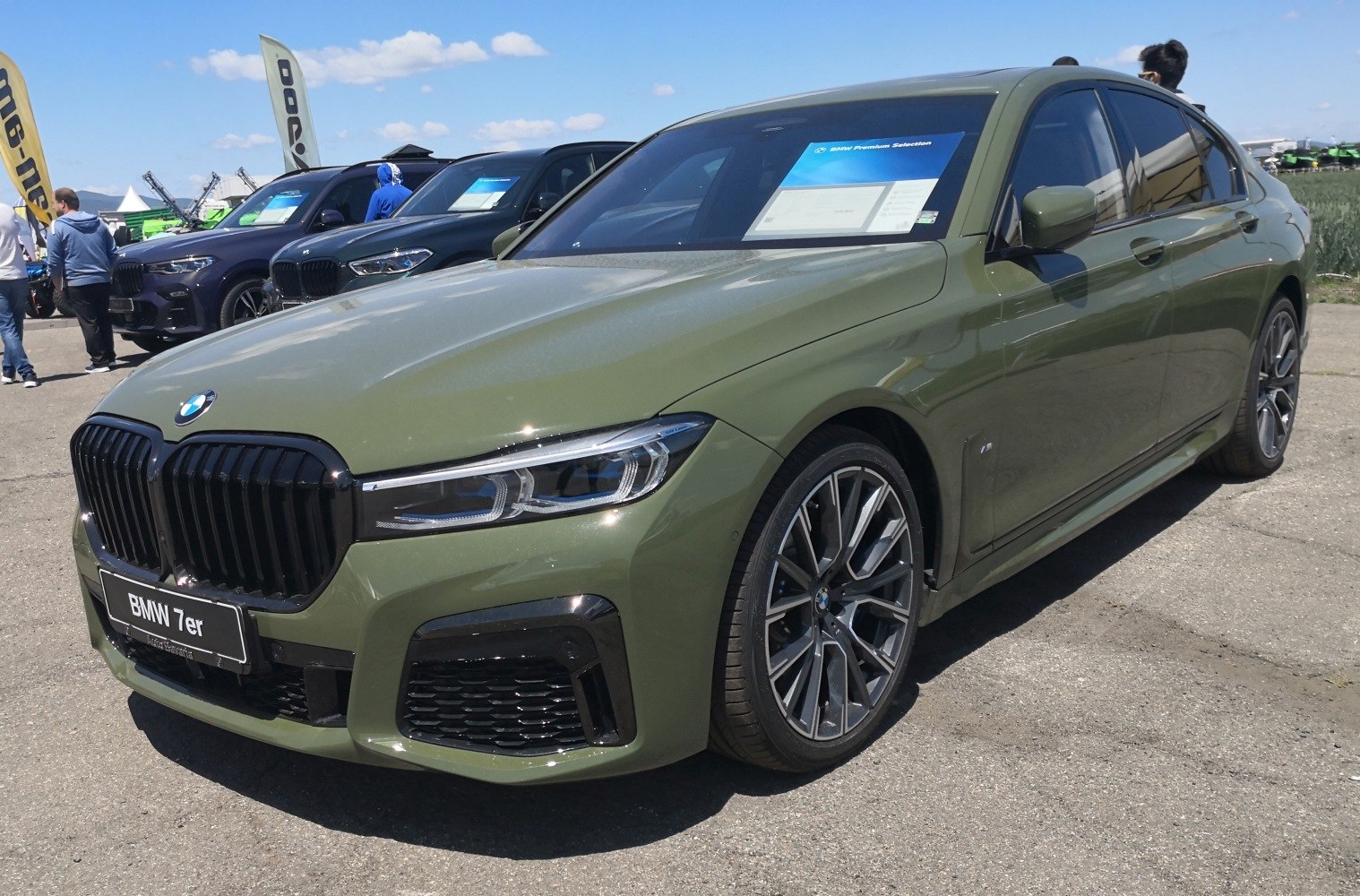 Blacked kidney grille and multi-spoke alloy wheels on a luxury sedan