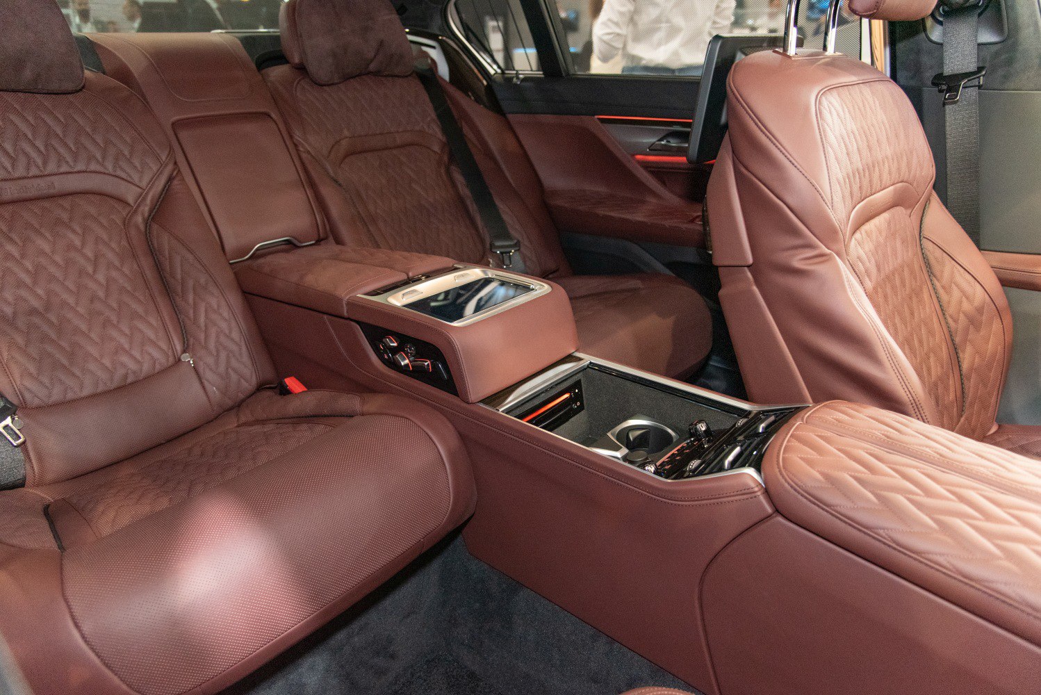 Brown leather rear seats with center console and digital controls