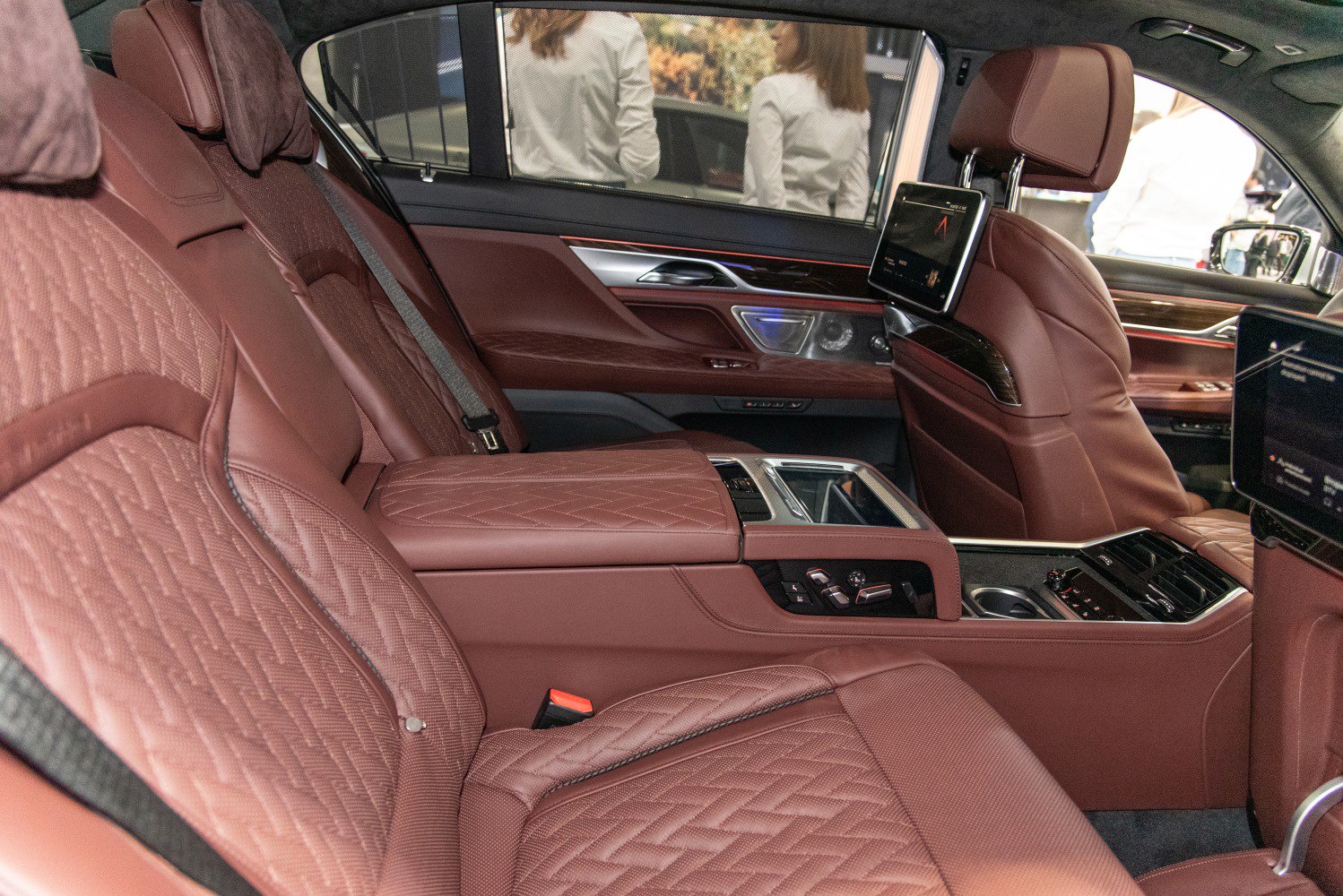 Quilted leather rear seats with entertainment screens and center console controls