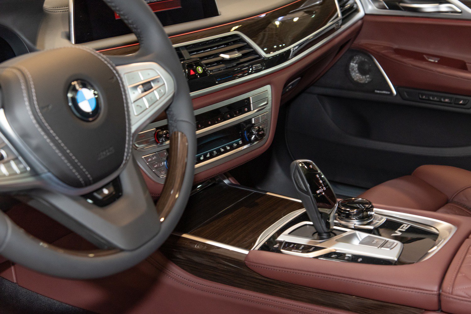 Luxury interior with gear shifter and wood trim