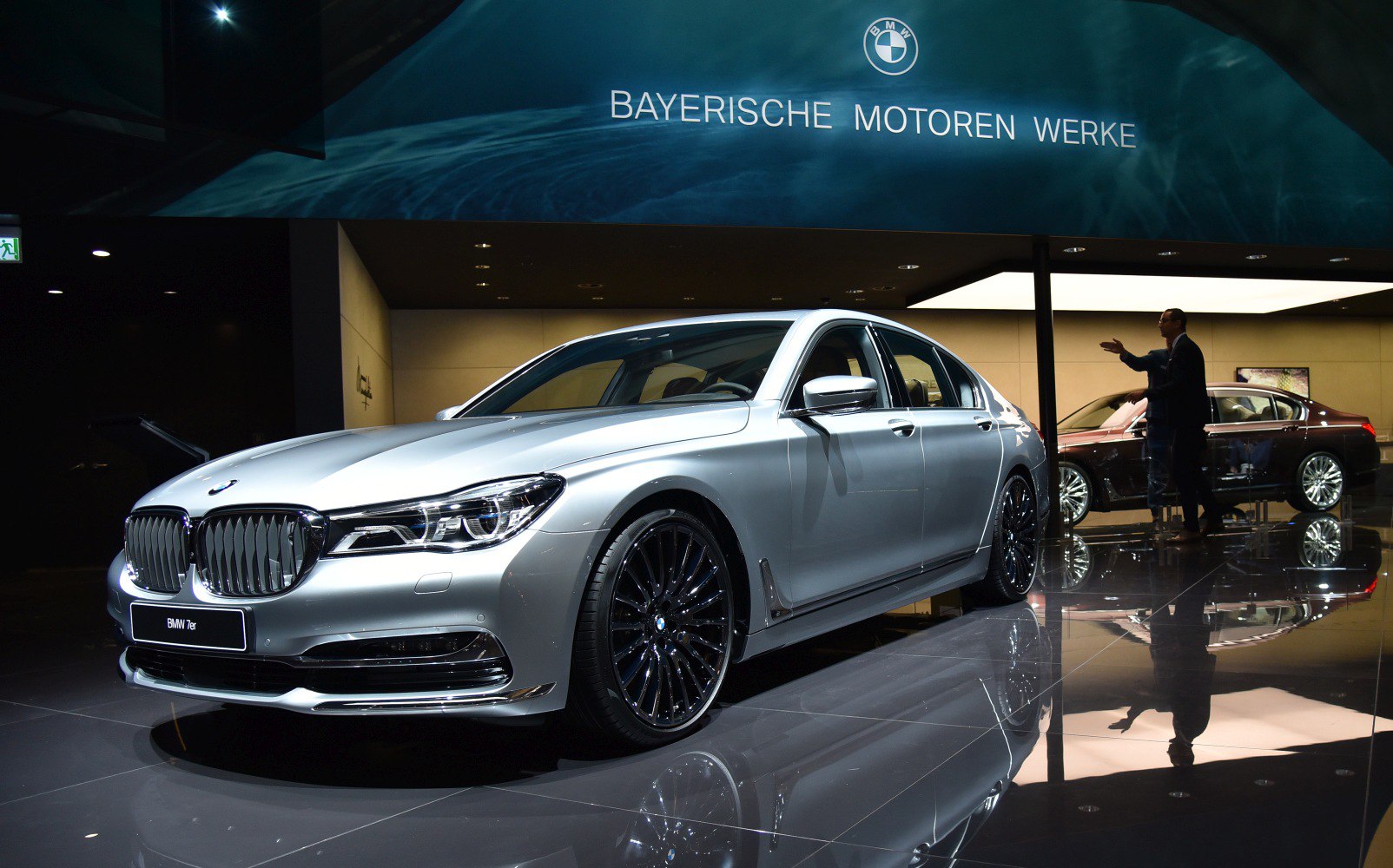 Front and side view of luxury sedan with kidney grille and alloy wheels