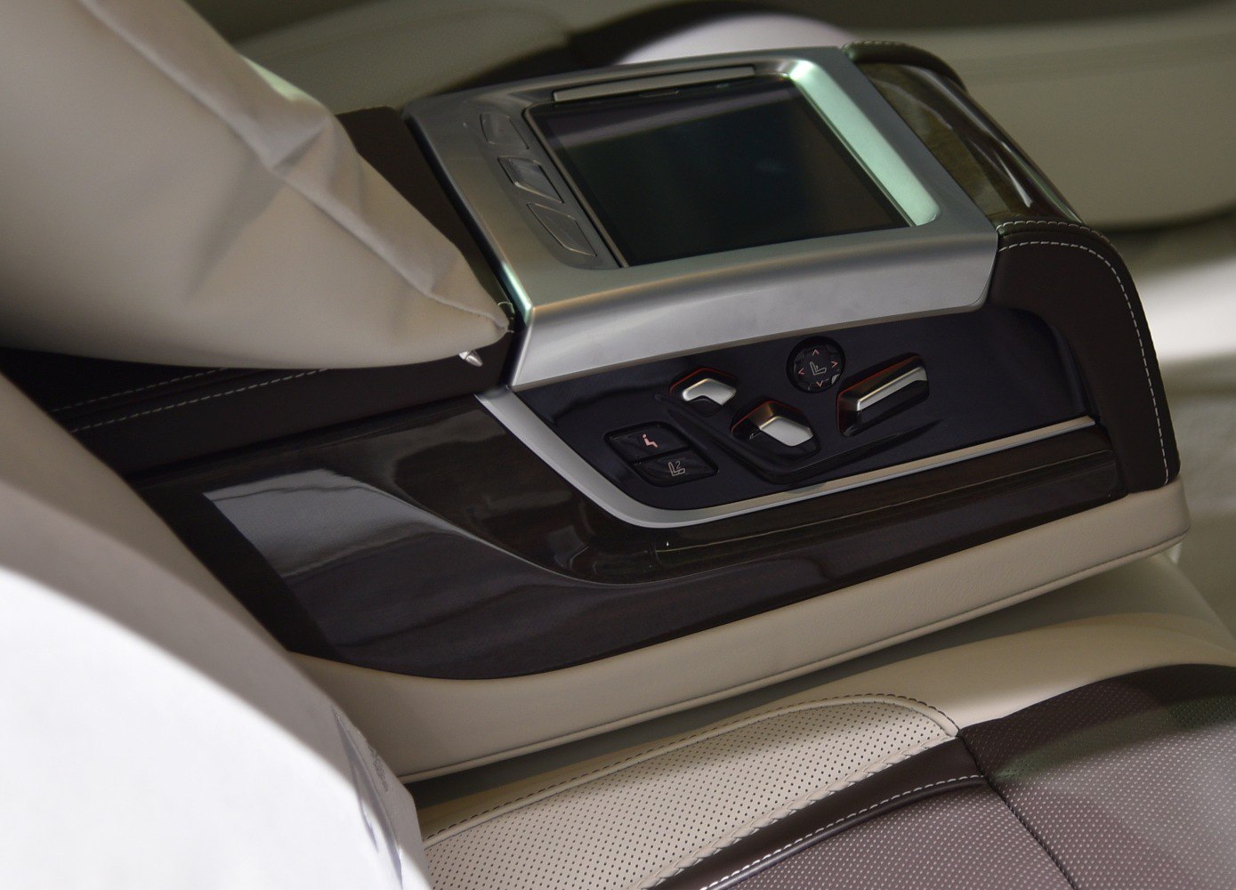 Rear seat control panel with touchscreen and ergonomic seat adjustment buttons