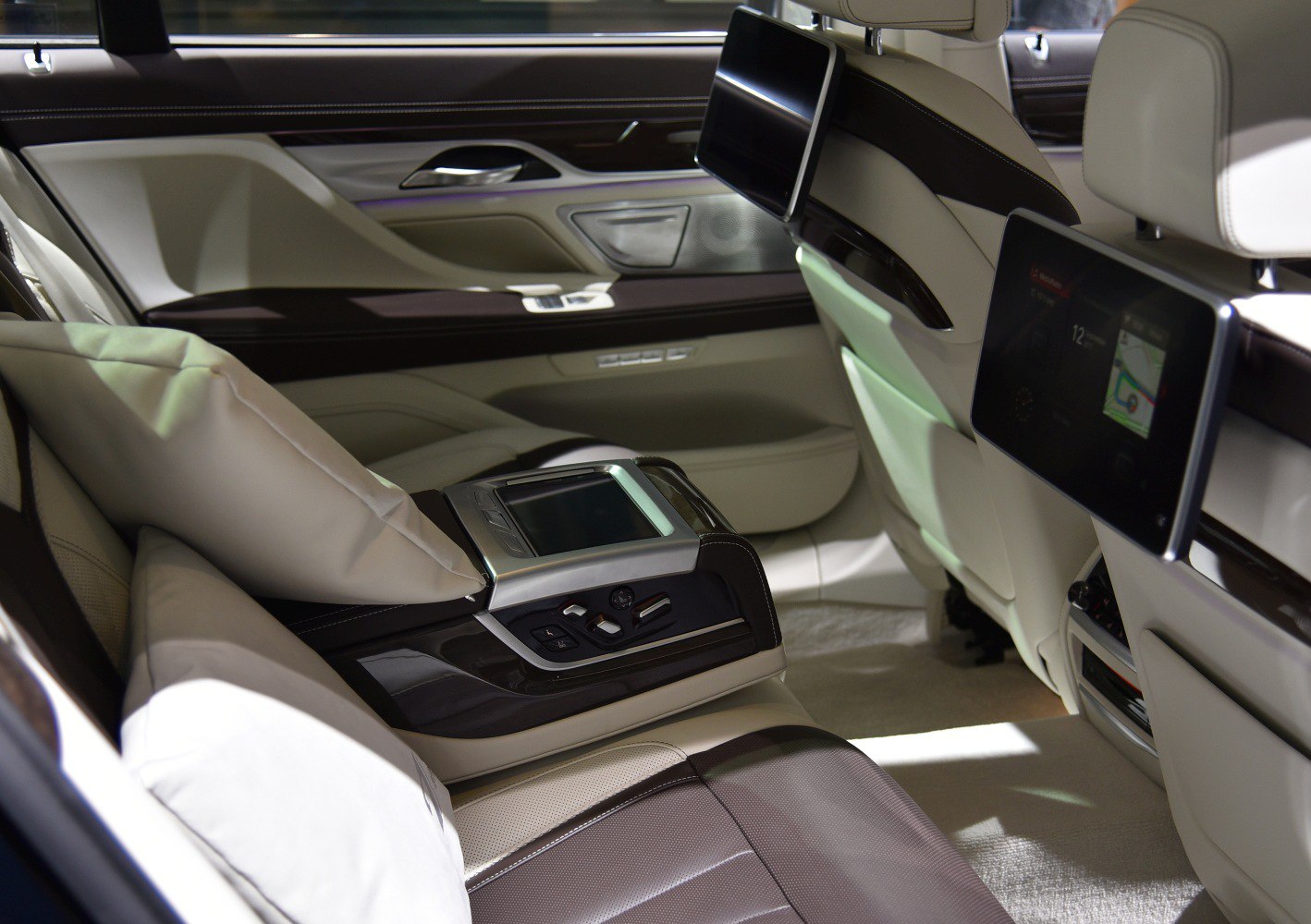 Rear seat interior with multimedia screens and premium controls
