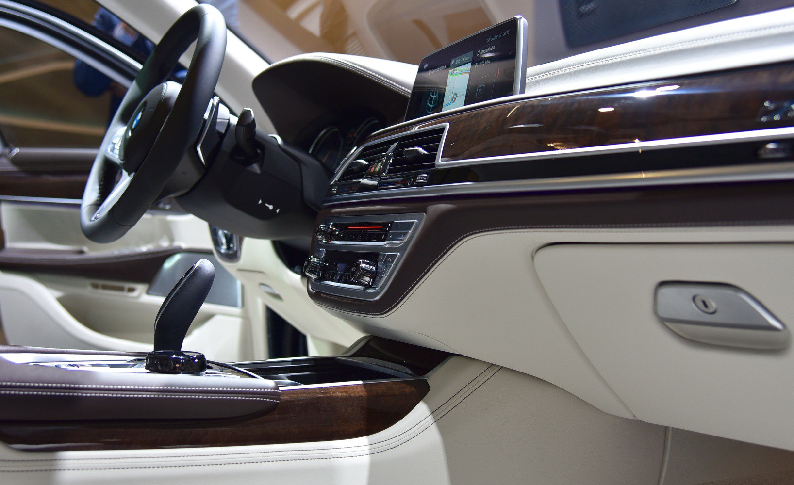 Luxury car interior with wooden trim and touchscreen dashboard