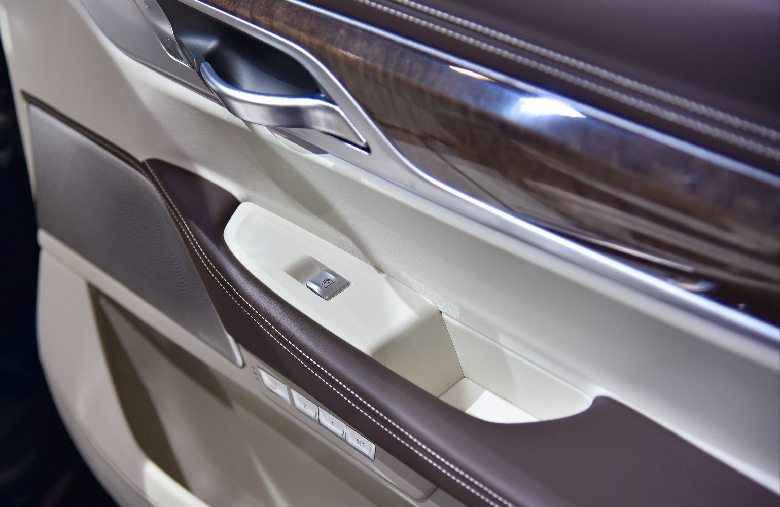 Interior door panel with wood trim and chrome handle