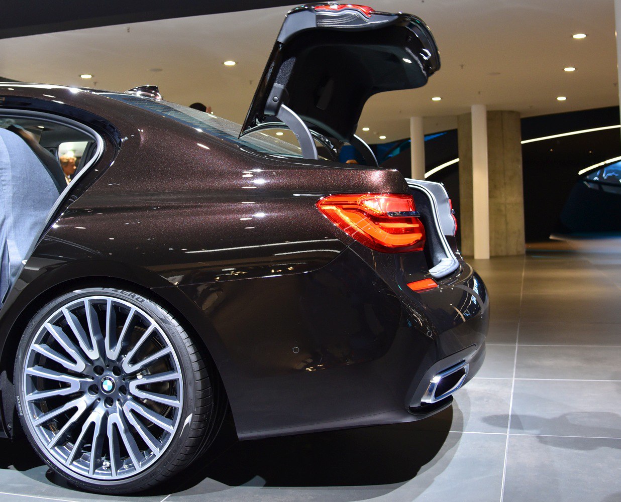 Rear side with open trunk, LED taillights and alloy wheel