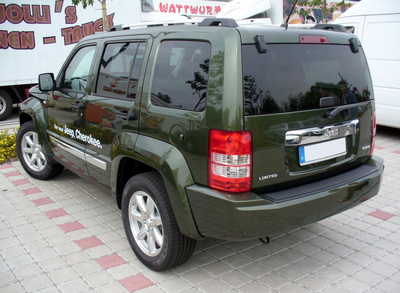 Rear side view of SUV with tinted windows and distinctive taillights