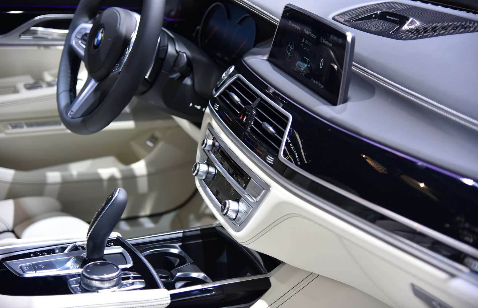 Luxury car interior dashboard with digital display and gear selector