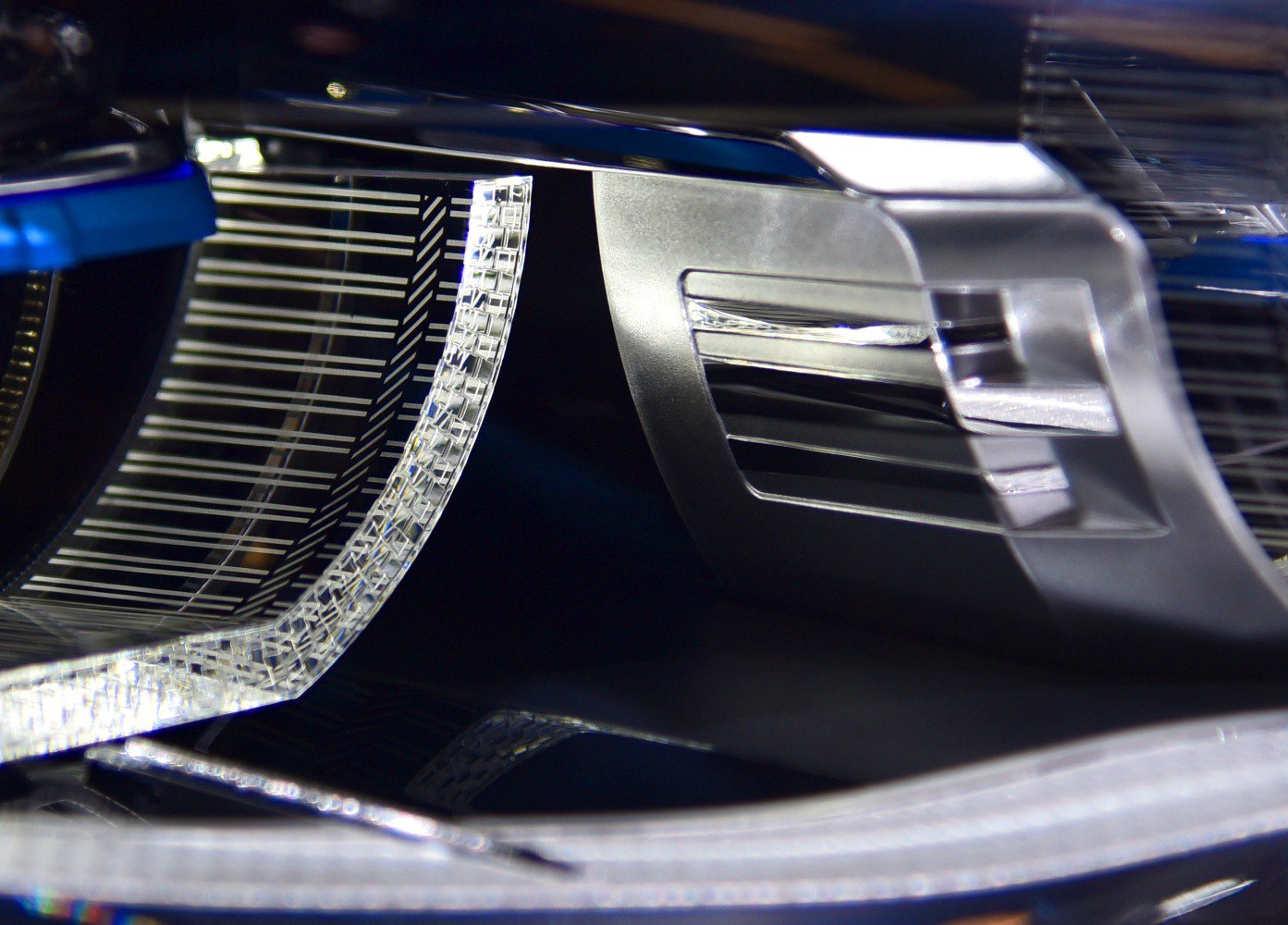 Close-up of modern automotive headlight with LED and reflective design