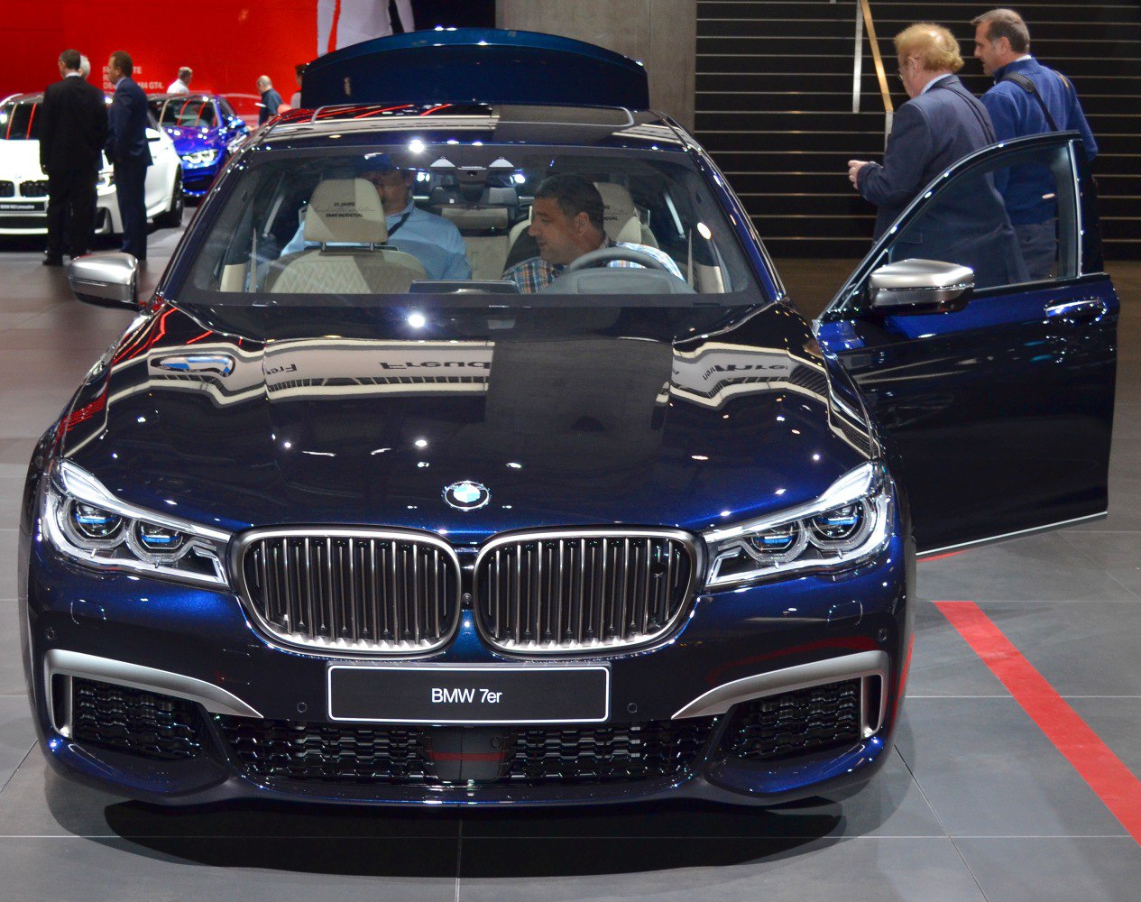 Front view with kidney grille, LED headlights, and open front door