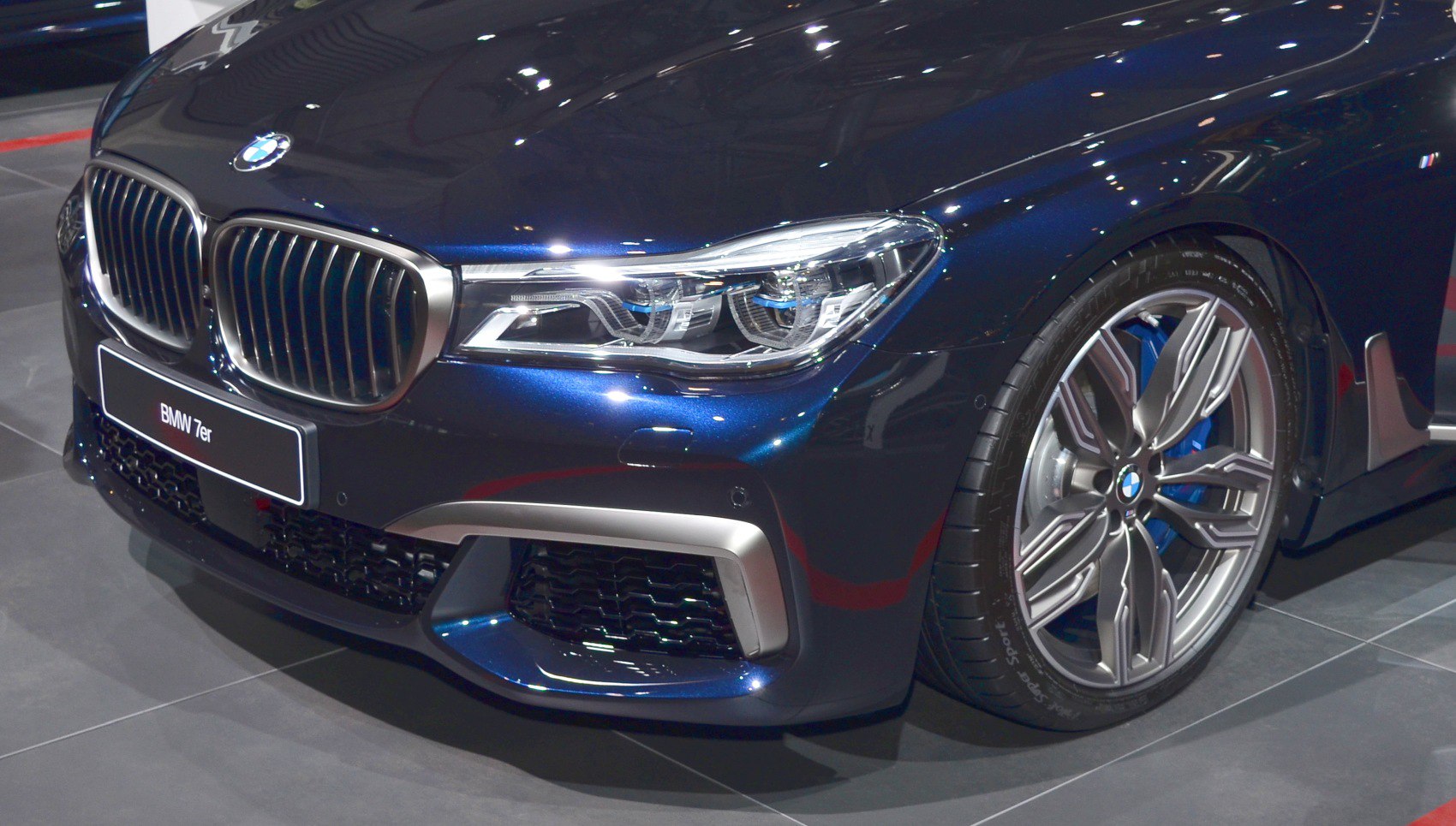 Front kidney grille, LED headlights, and alloy wheel design