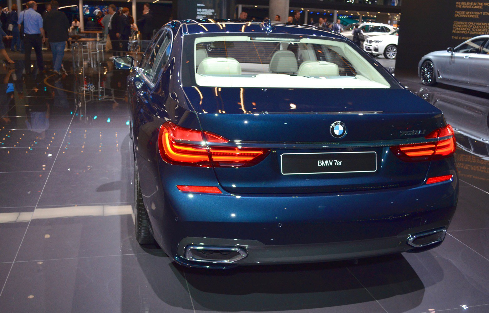 Rear view with LED tail lights and dual exhaust of luxury sedan