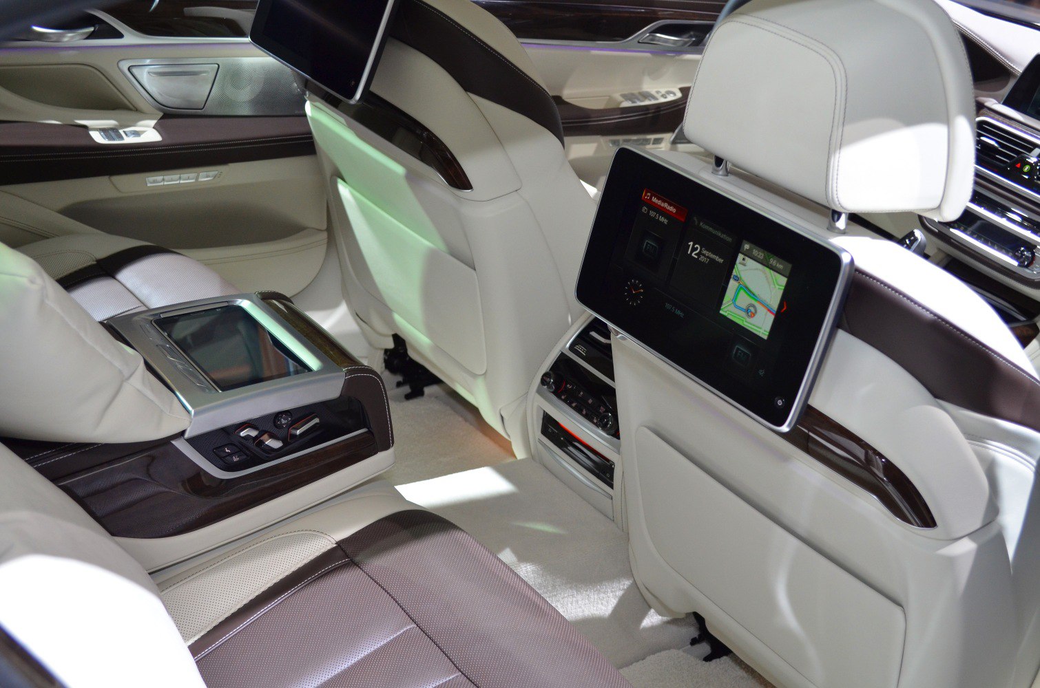 Luxury rear seats with dual screens and control panel