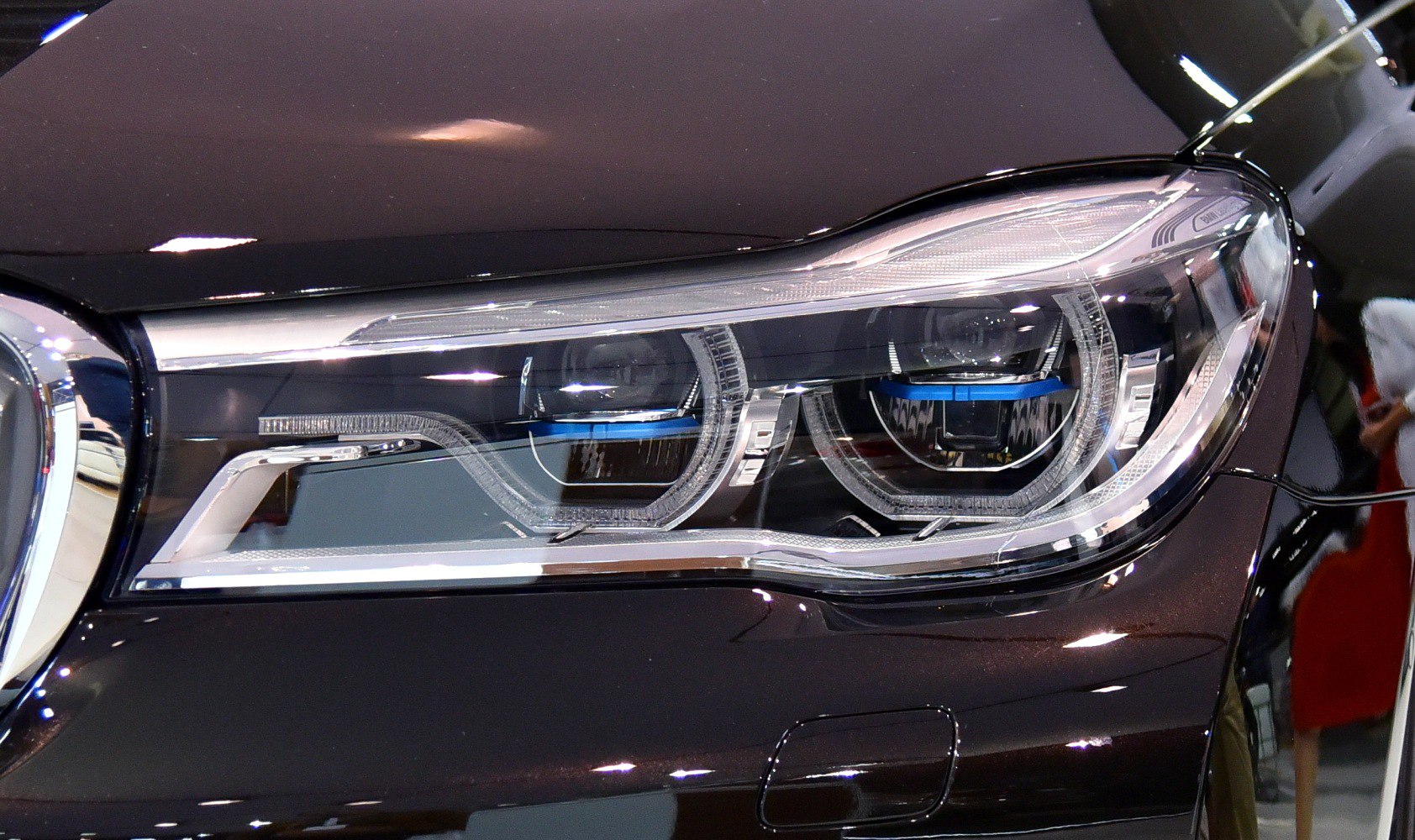 Close-up of adaptive LED headlight with dual projector lenses and intricate detailing