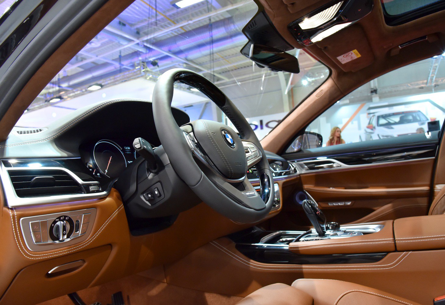 Luxury brown leather interior with advanced steering wheel and dashboard