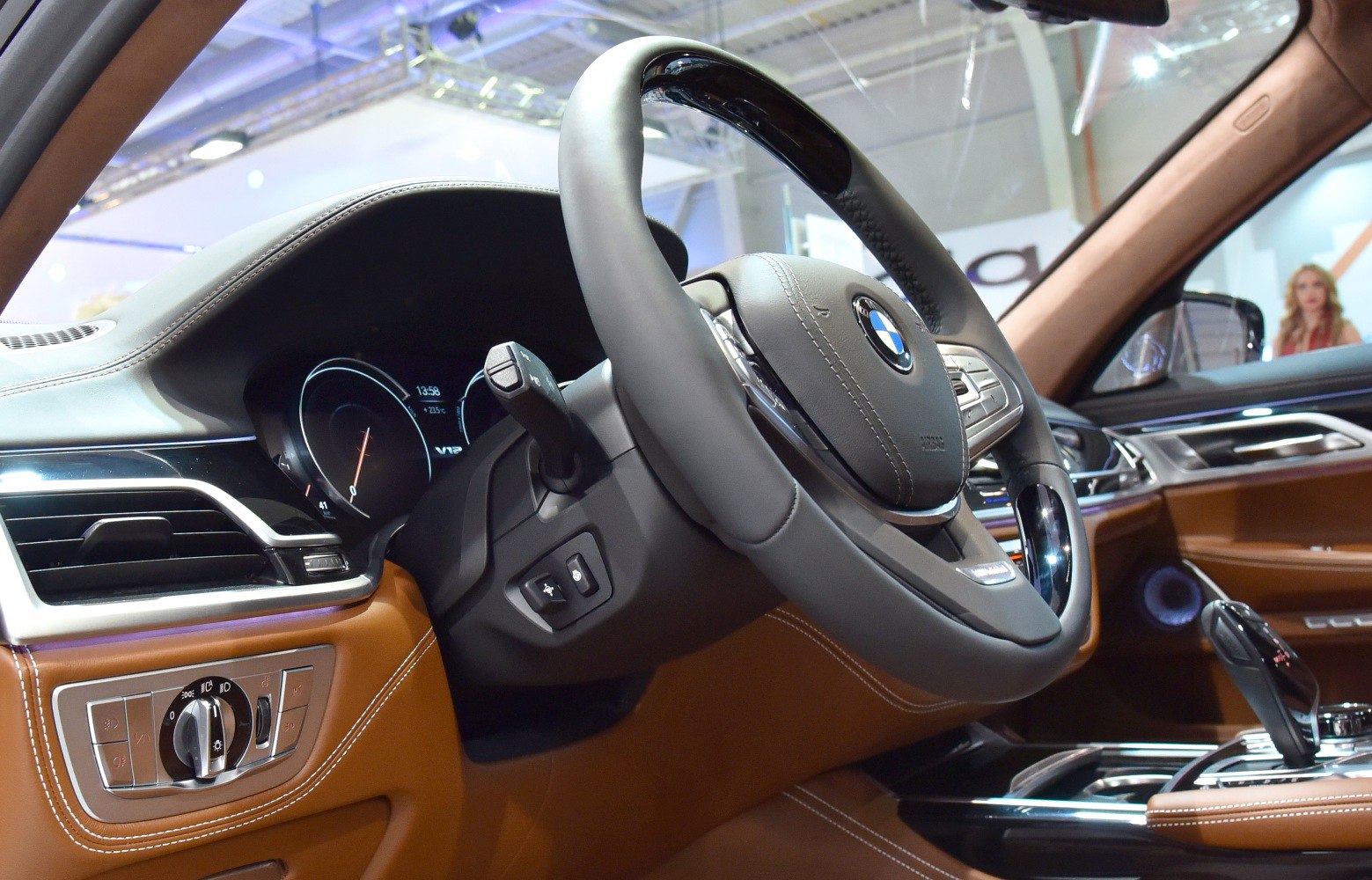 Steering wheel and detailed dashboard control panel with leather upholstery