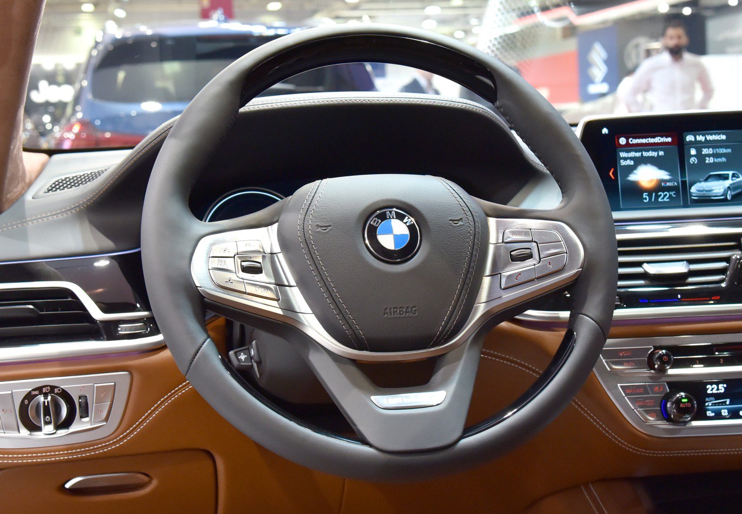 Steering wheel with control buttons and dashboard display
