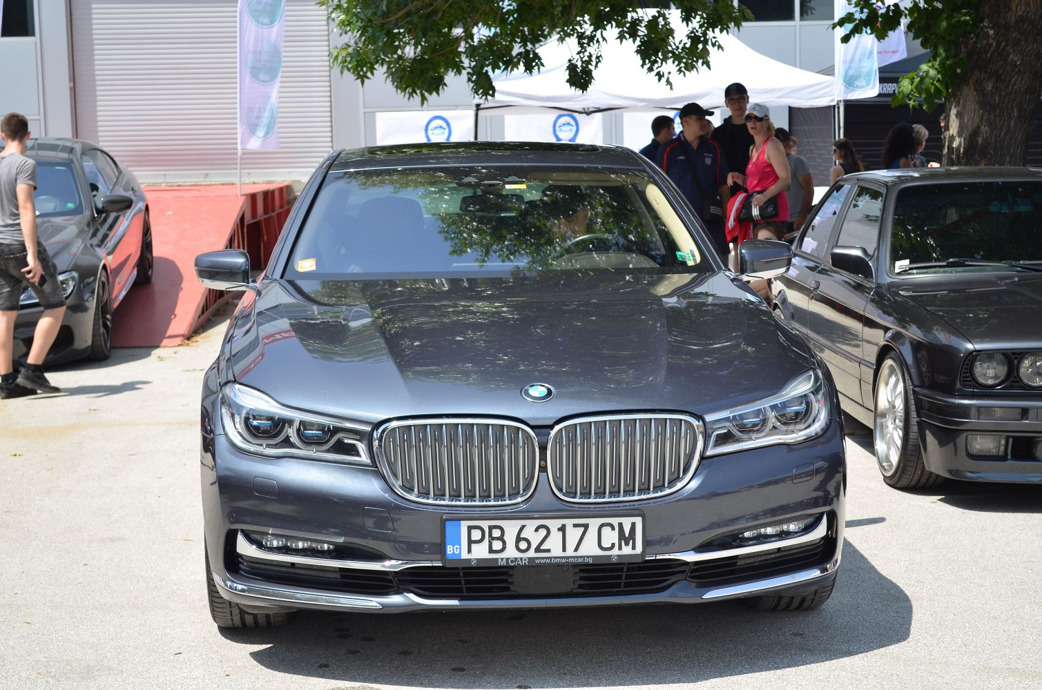 Luxury sedan front with kidney grille and LED headlights