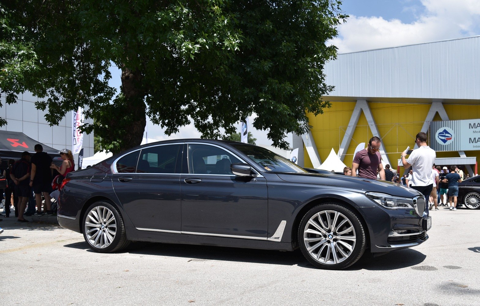 Side profile of luxury sedan with sleek body and alloy wheels