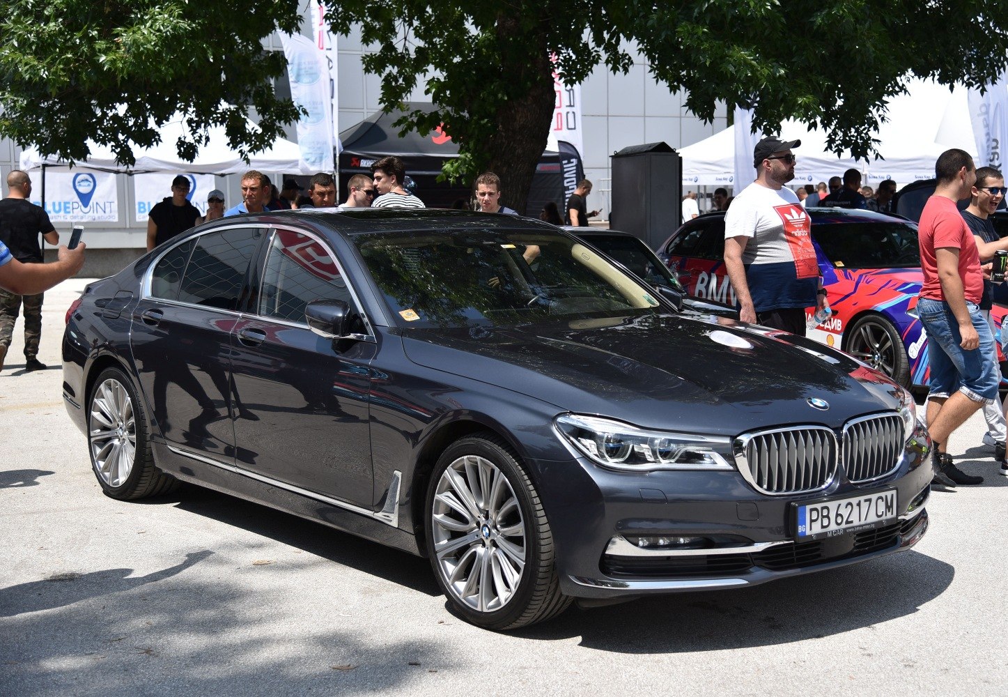 Luxury sedan front side with alloy wheels and sleek design