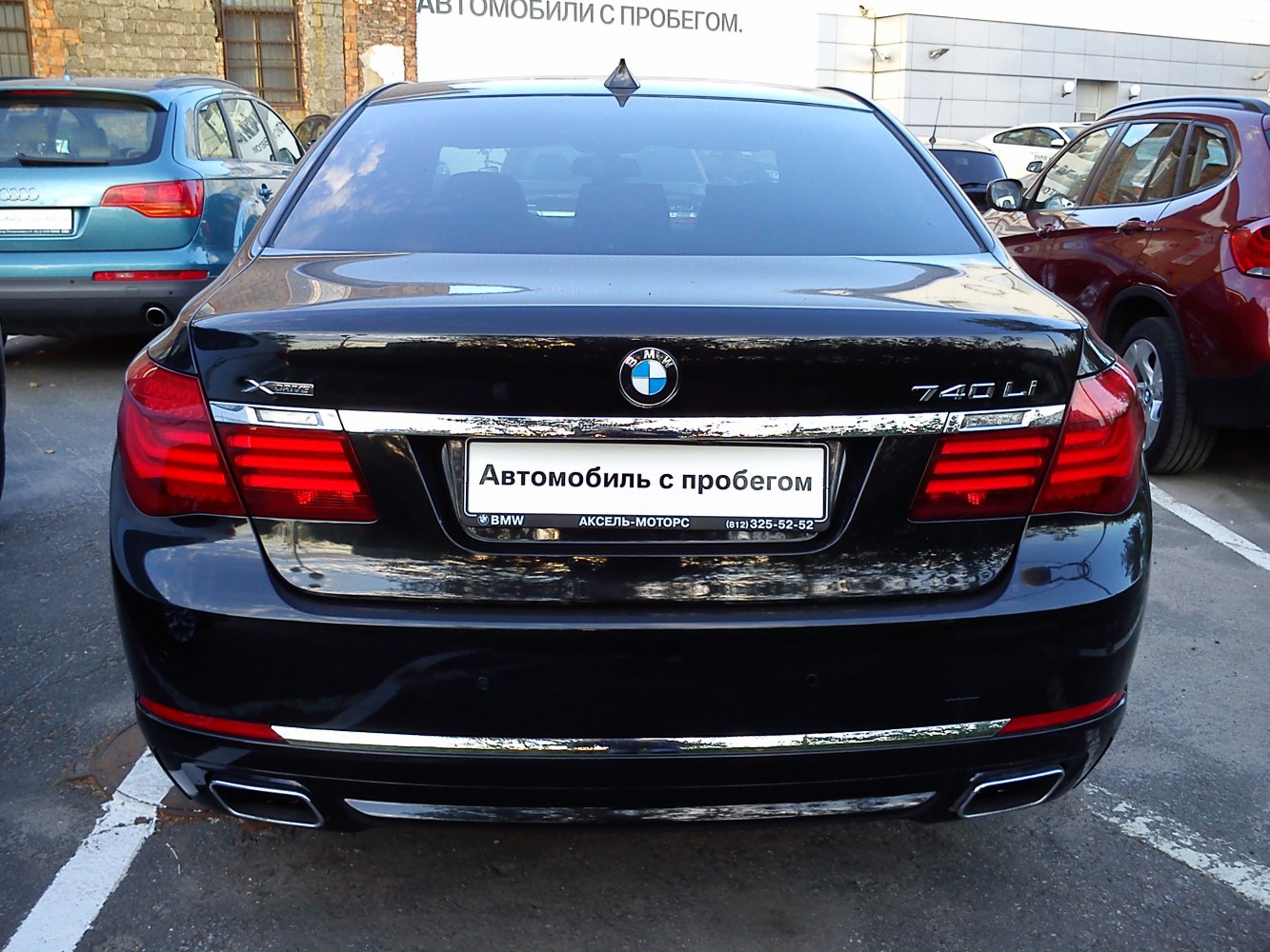 Rear view with 740Li xDrive badges and taillights