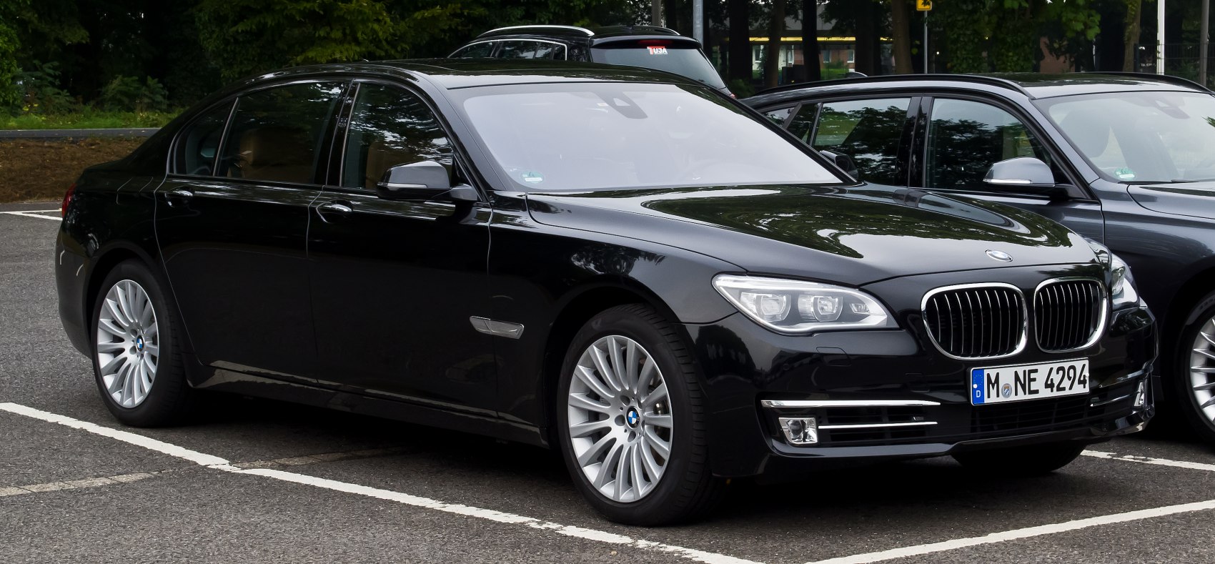 Luxury black sedan with kidney grille and sleek headlights