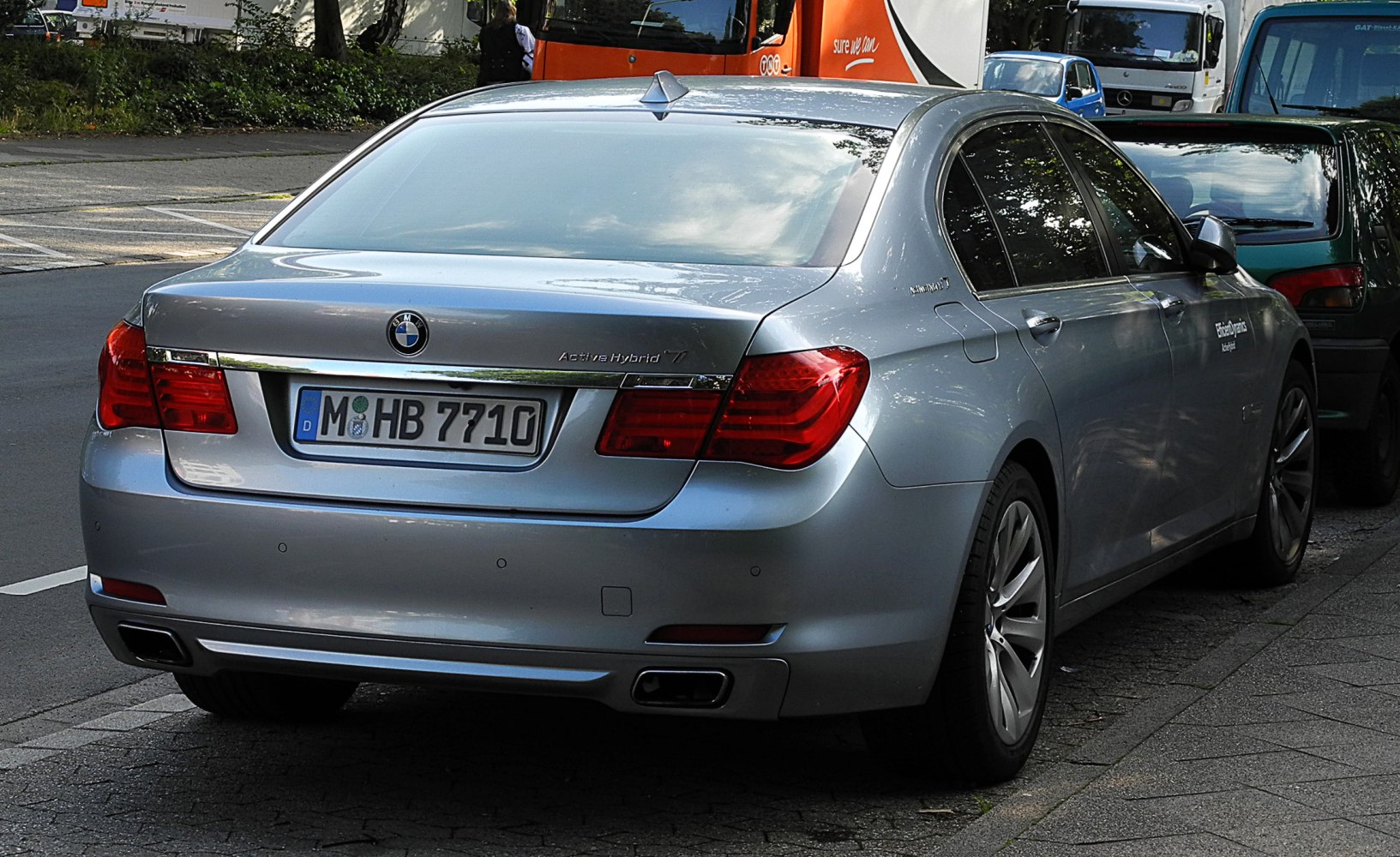 Rear hybrid sedan with LED taillights and dual exhausts