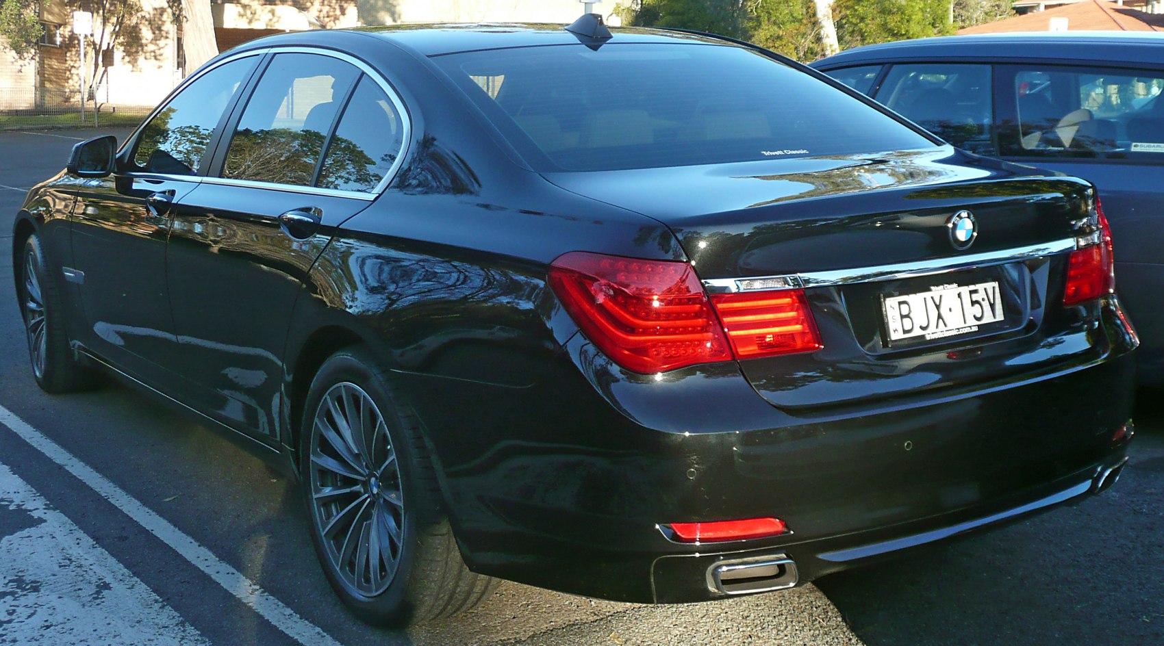 Rear view with LED tail lights and alloy wheels.