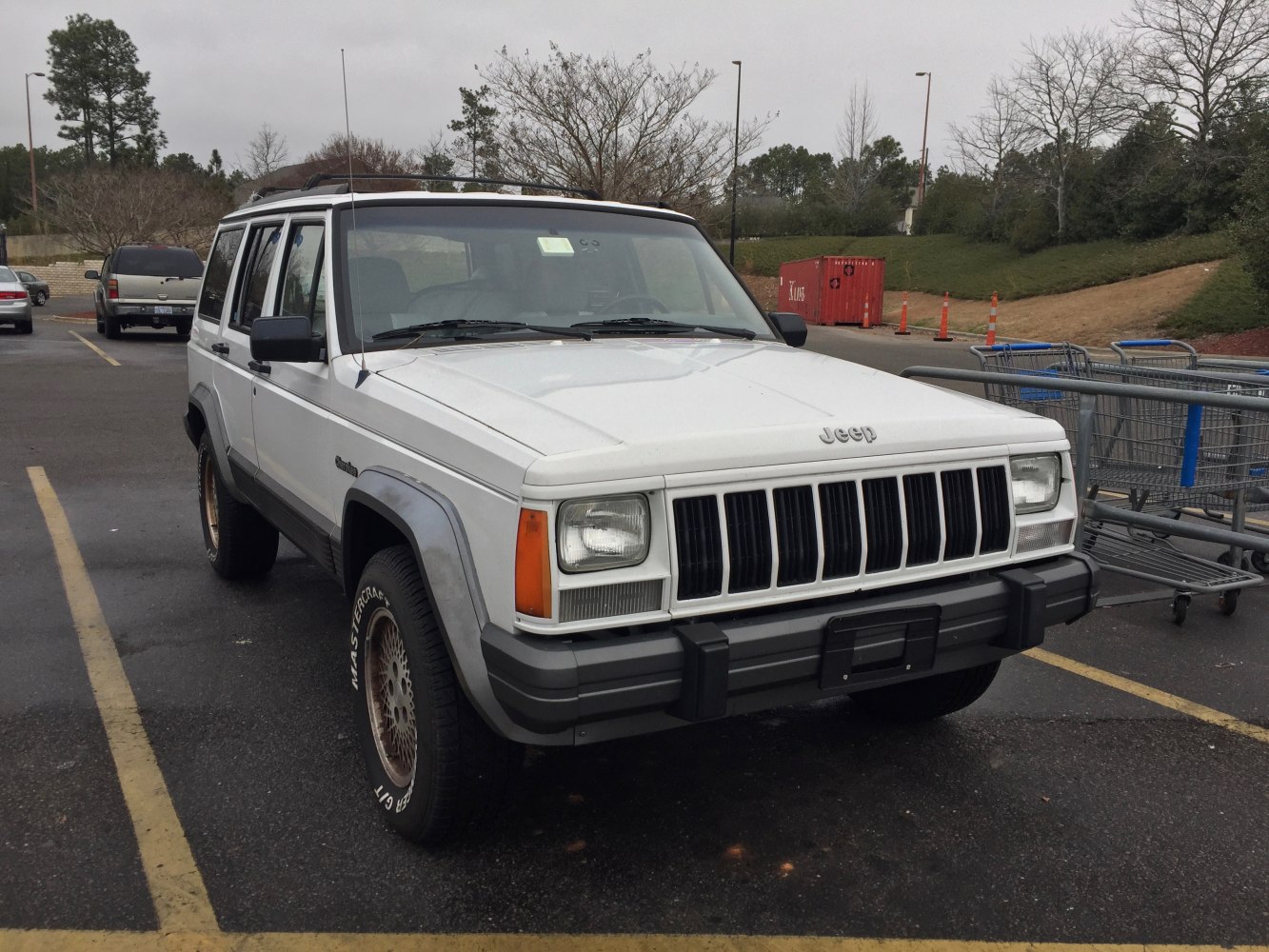 White SUV with vertical grille and rectangular headlights