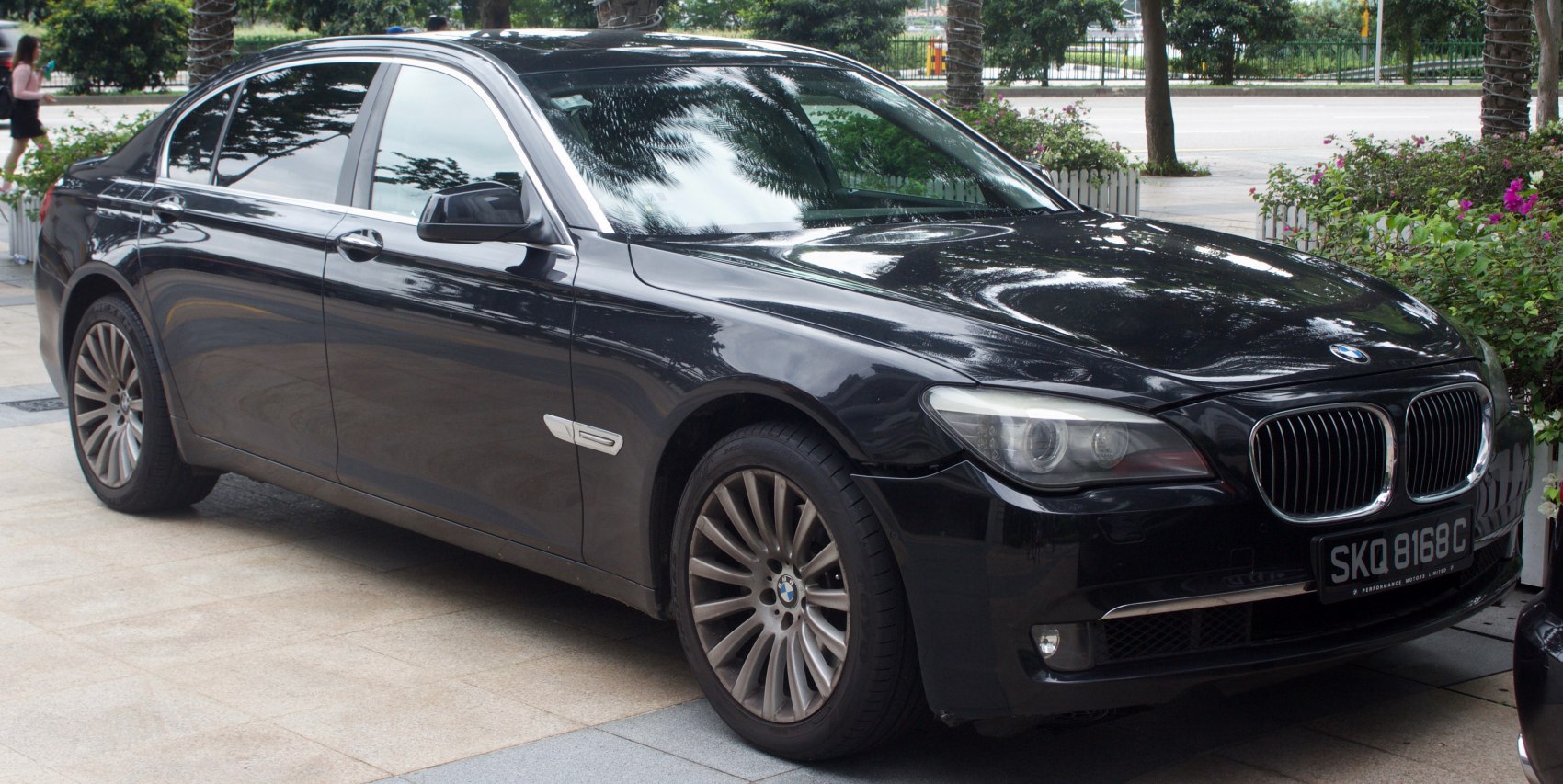 Black luxury sedan with distinct front headlights and alloy wheels