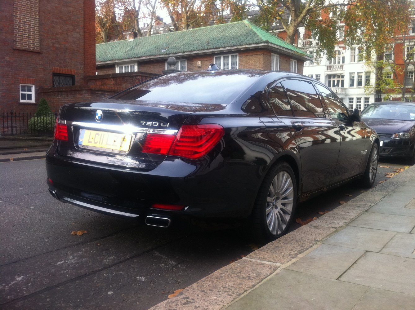 Rear view with distinct tail lights and dual exhausts