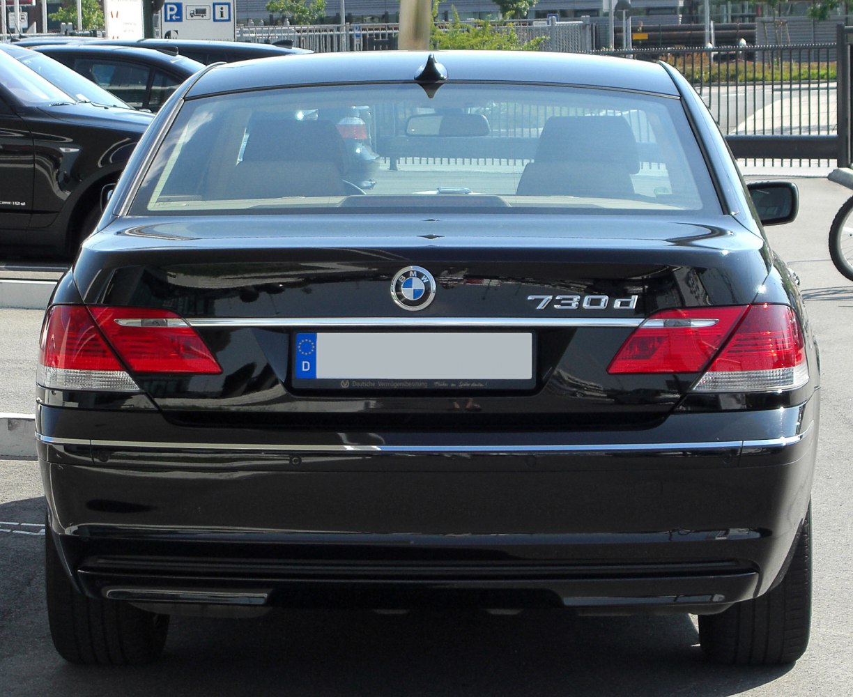 Rear view of luxury sedan with distinct taillights and badge