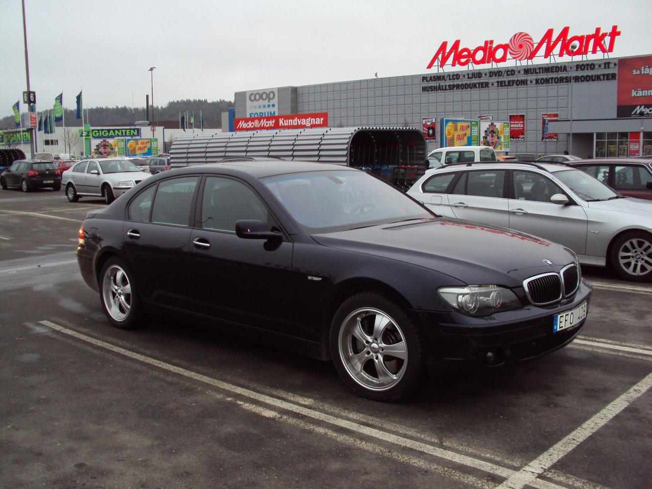 Luxury sedan with front three-quarter view and alloy wheels