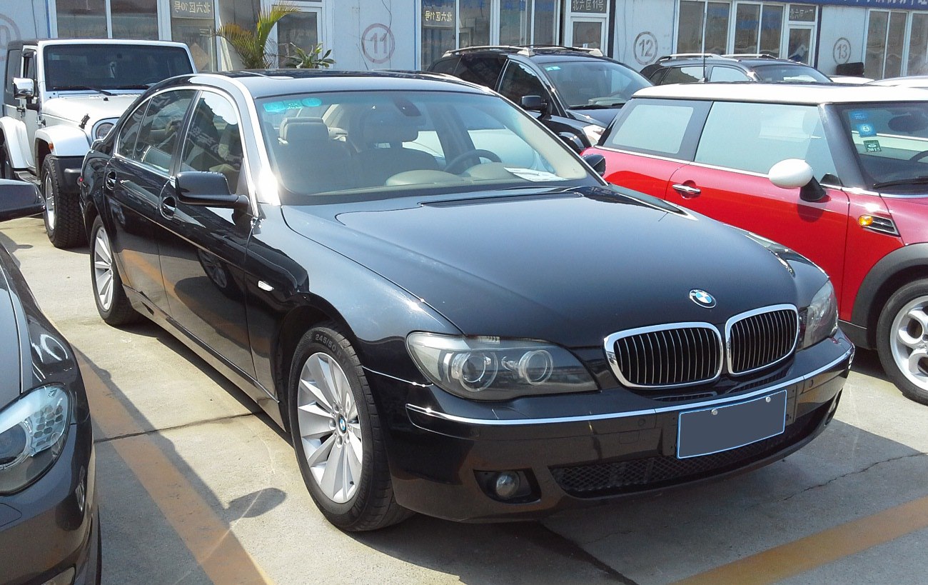 Luxury sedan front view with kidney grille and detailed headlights