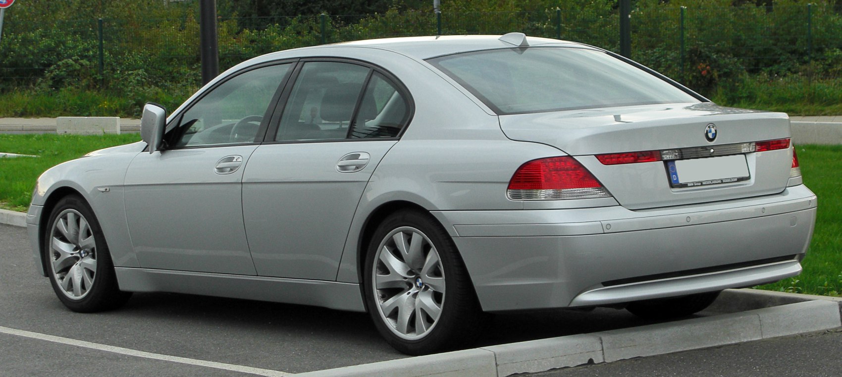 Rear side profile with tail lights and alloy wheels