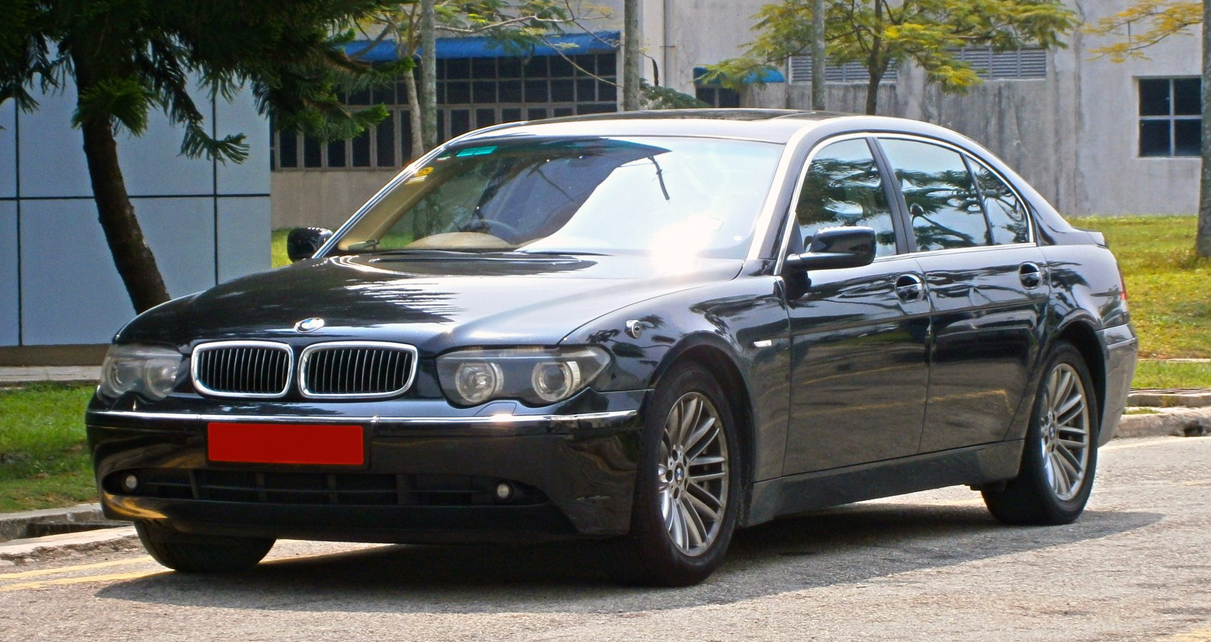 Luxury sedan with dual headlights and kidney grille front 3-4 view