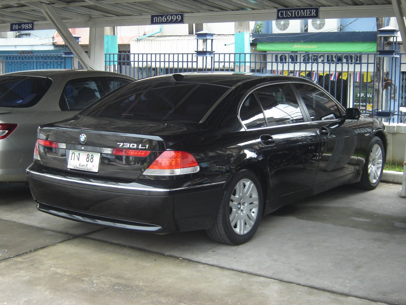 Luxury sedan rear view with signature taillights and chrome trim