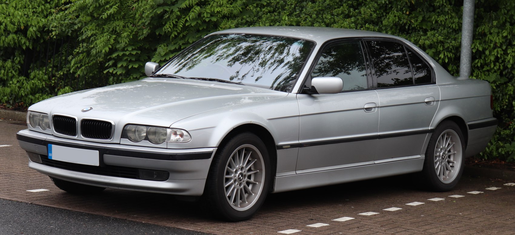 Silver sedan with dual headlights and alloy wheels