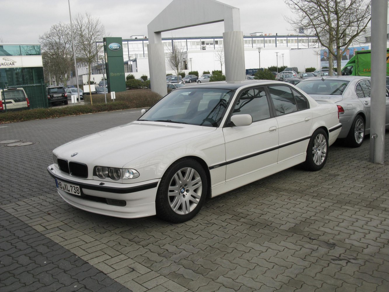White luxury sedan with distinctive front and alloy wheels