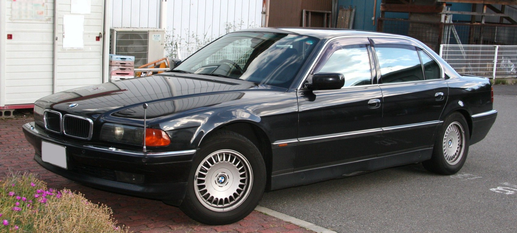 Long wheelbase sedan with alloy wheels and front antenna