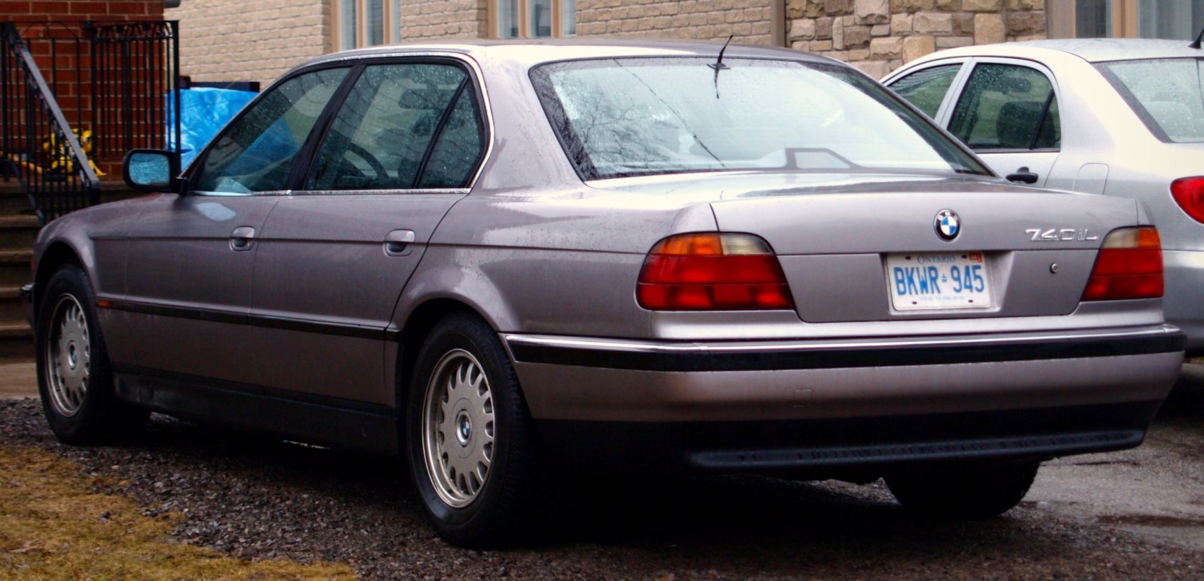 Rear side view with classic tail lights and long wheelbase body design