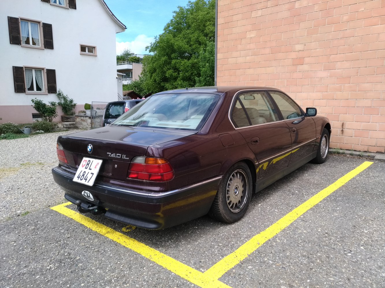 Rear view with classic taillights and tow hitch