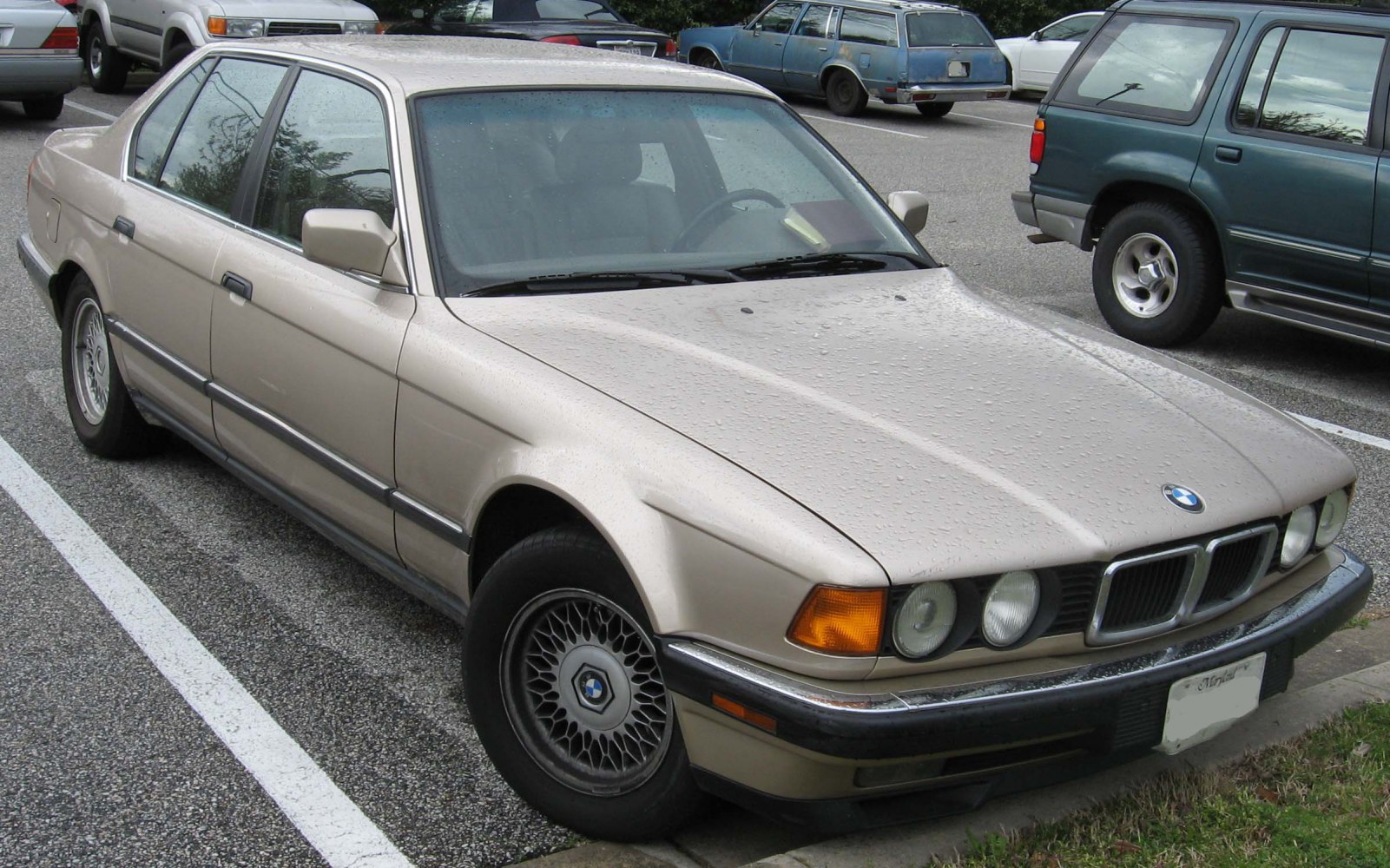 Luxury sedan with round headlights and kidney grille front view