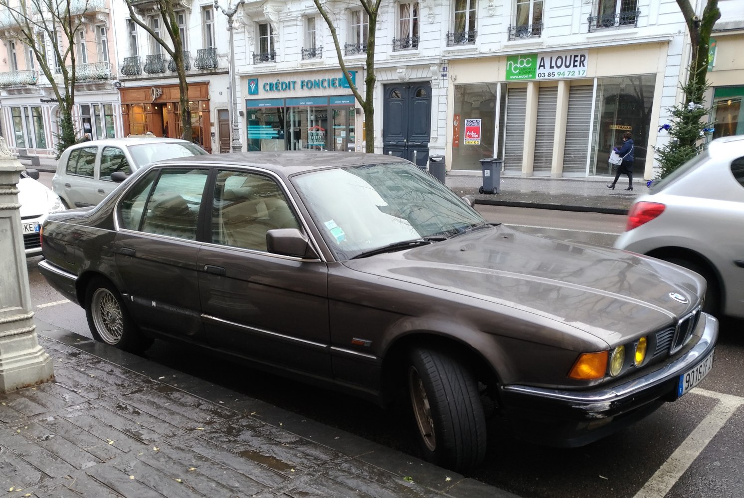 Front side view with quad headlights and classic sedan body