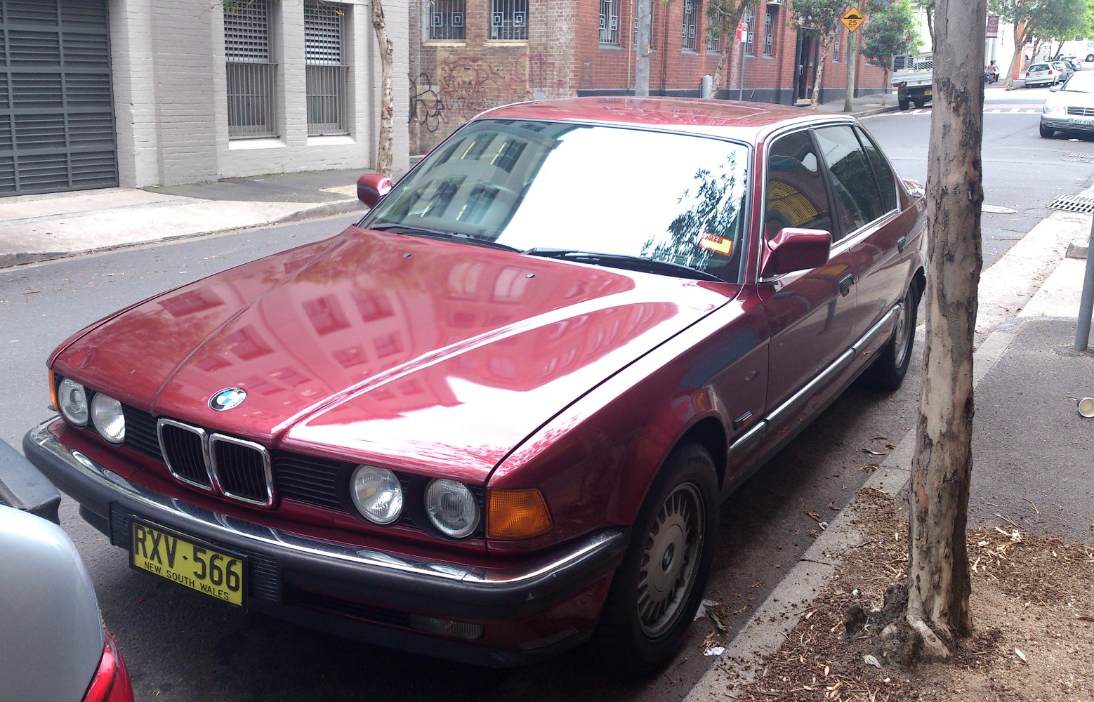 Front-side view with quad round headlights on vintage sedan