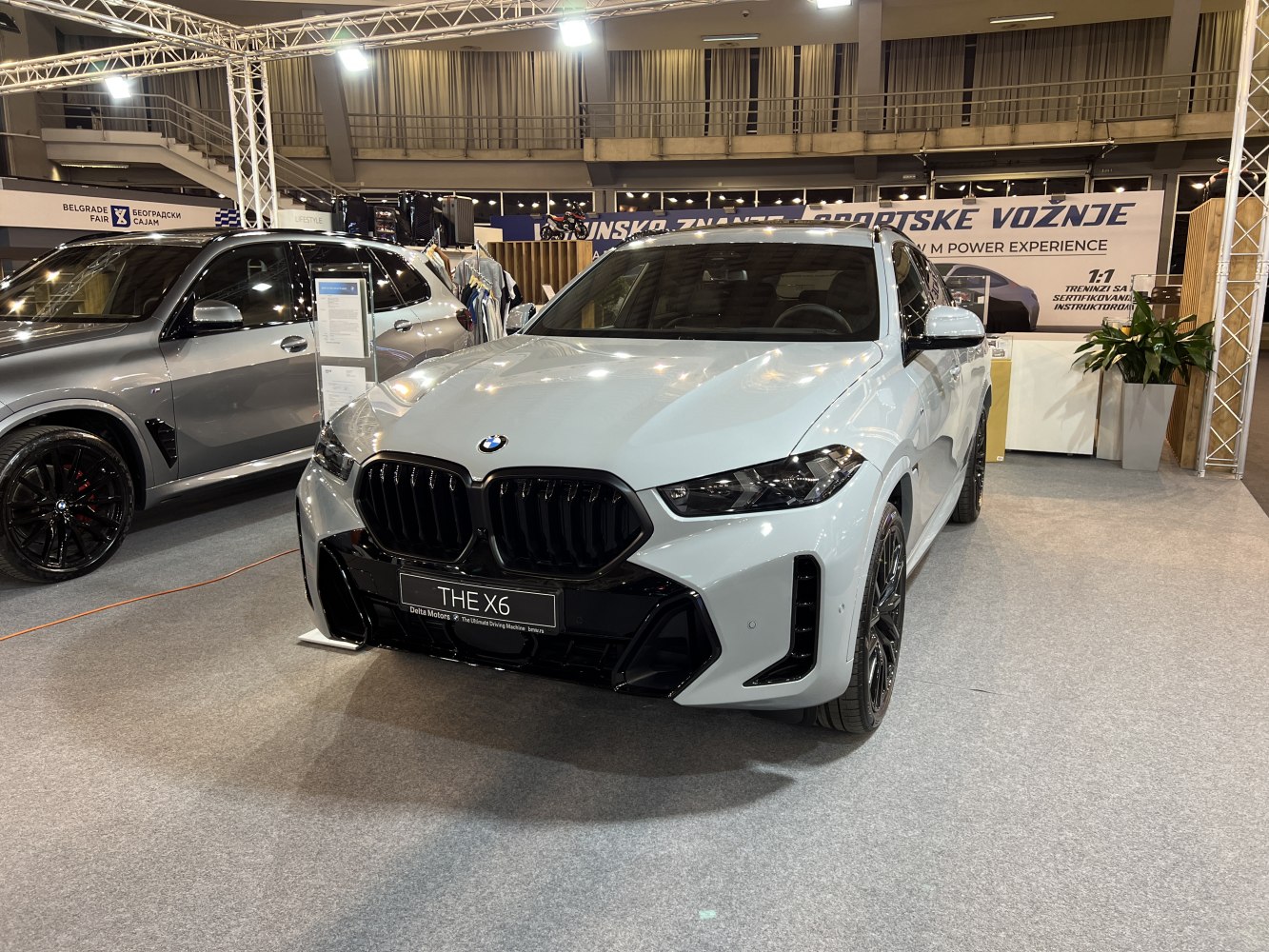 Front view with black kidney grille and sleek headlights