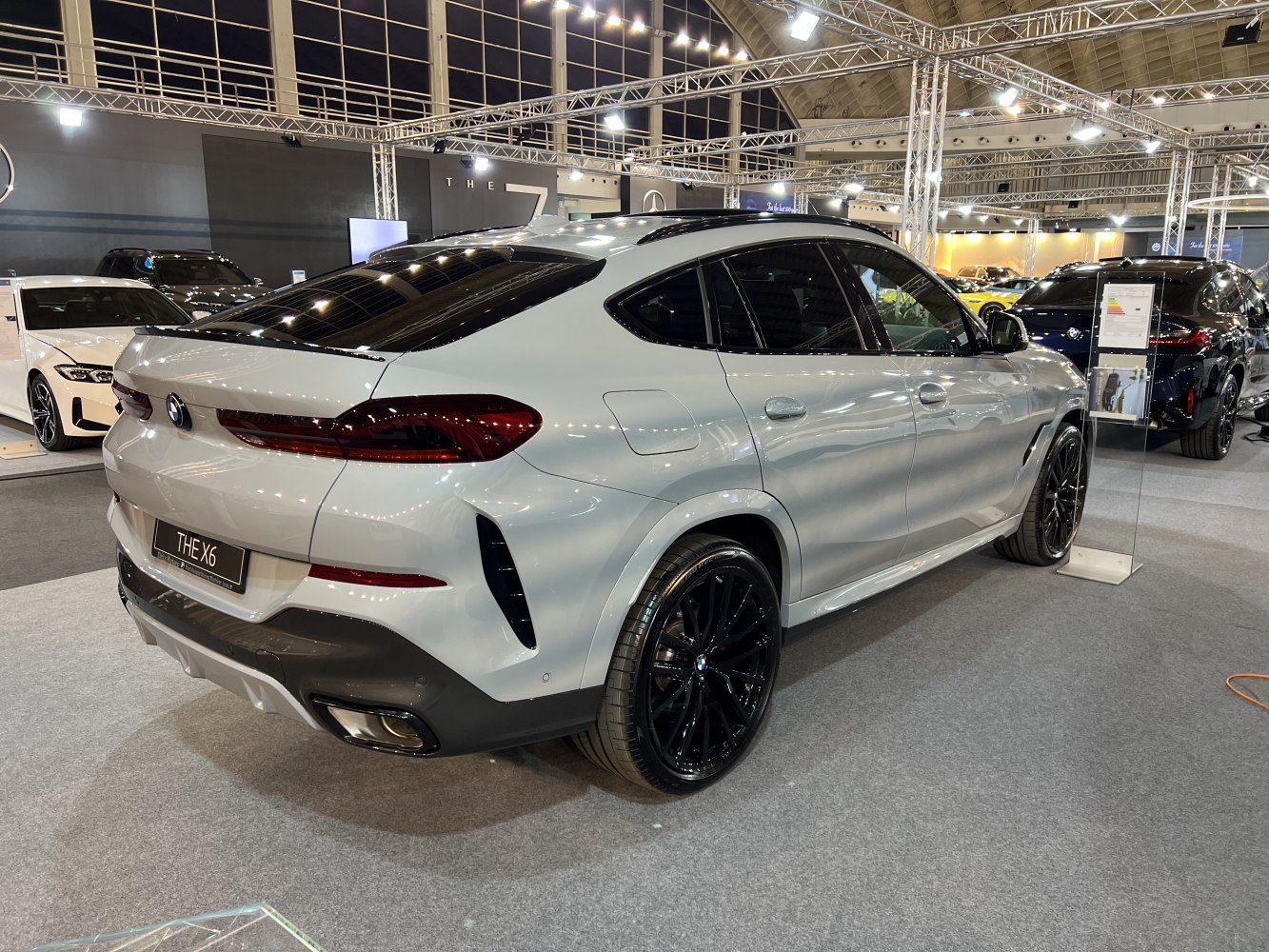 Silver SUV rear and side view with updated taillights and black wheels