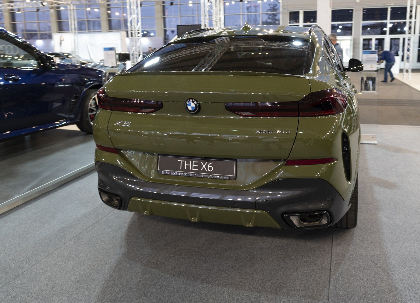 Rear view of sporty SUV with signature taillights and dual exhausts