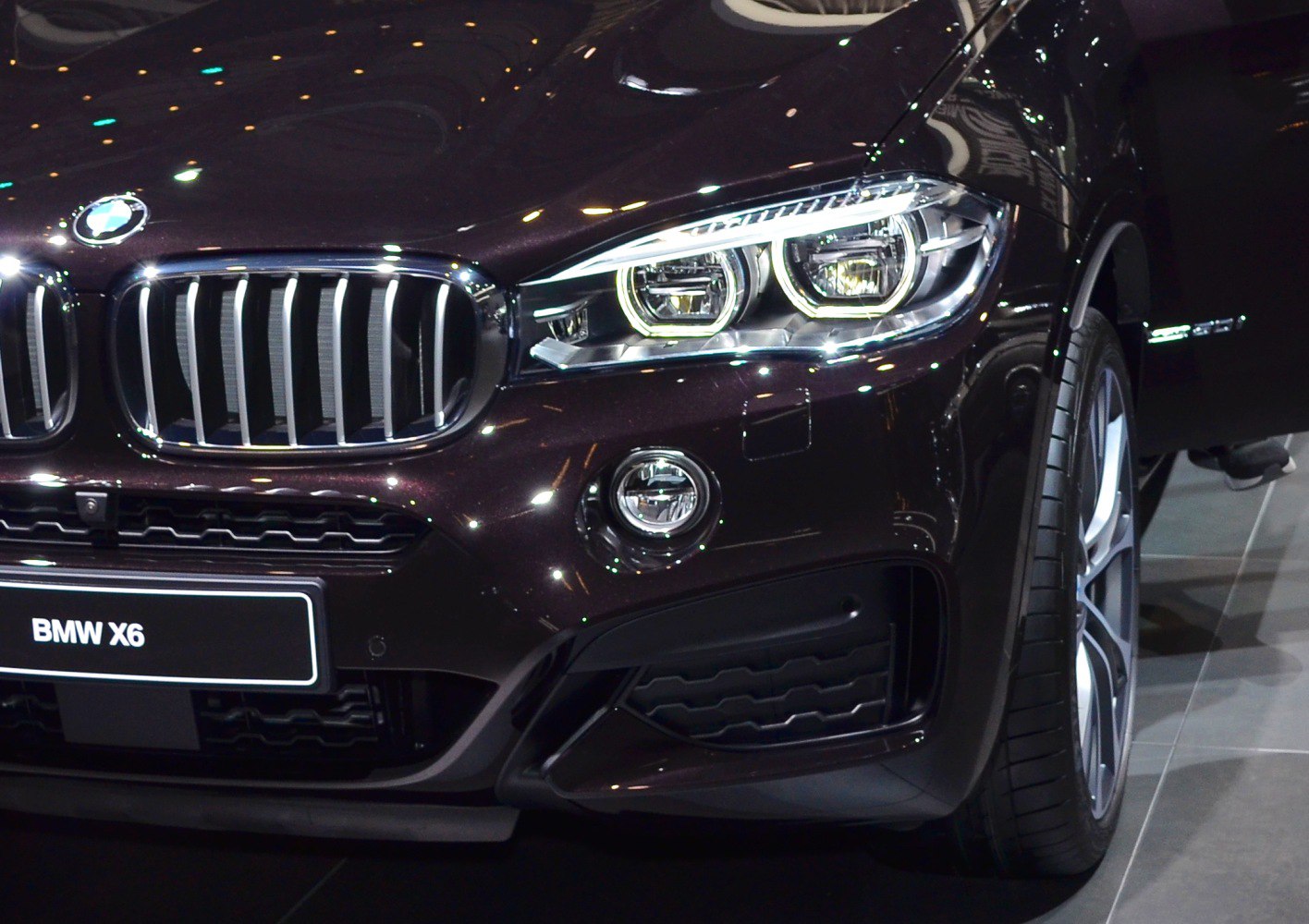 Close-up of front grille and LED headlights